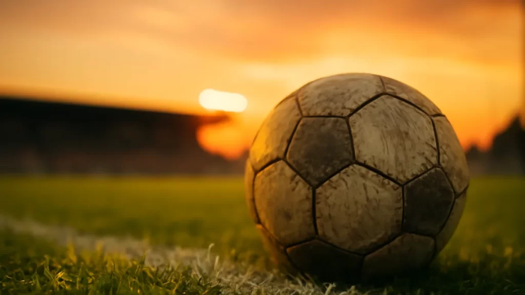 Esther González signs for Al Qadsiah after leaving Gotham FC Match ball on wet pitch near goal, sunset glow and floodlights