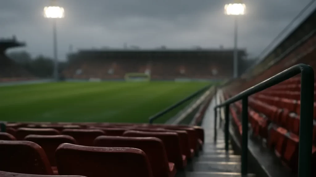 What different ticket price tiers actually buy you Wet rows of stadium seats leading down toward a blurred pitch and goal